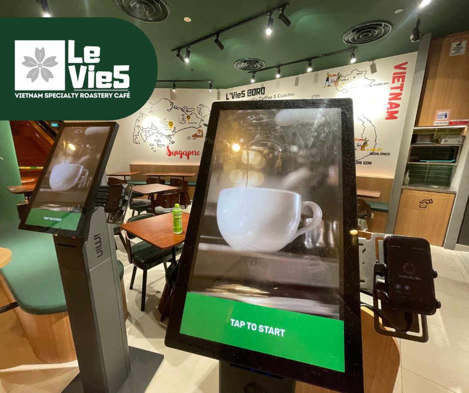 High angle view of a modern restaurant with multiple self-ordering kiosks